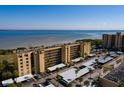 Exterior view of the condo building with covered parking and view of the bay at 2617 Cove Cay Dr # 710, Clearwater, FL 33760