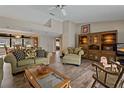 Cozy living room with plush seating, wood floors, and classic decor at 4450 Dior Rd, Spring Hill, FL 34609