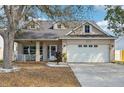 Charming single-Gathering home featuring a spacious front porch and well-manicured lawn at 4710 69Th E Ct, Palmetto, FL 34221