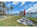 Relaxing outdoor seating by the water, complete with picnic tables and barbecue grill at 9715 Harrell Ave # 22, Treasure Island, FL 33706