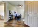 Spacious office with wood floors, fan, natural light, and space for desk and shelving at 11257 Egeria Dr, Odessa, FL 33556