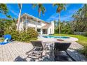 Relaxing backyard with a sparkling pool and comfortable lounge chairs on a sunny day at 7821 17Th W Ave, Bradenton, FL 34209