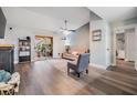 Open-concept living room featuring a large window, hardwood floors, and a ceiling fan at 9481 Highland Oak Dr # 706, Tampa, FL 33647