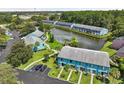 A picturesque community, featuring beautiful landscaping, a tranquil pond, and ample parking at 20890 Negril Ct # 5, Lutz, FL 33558
