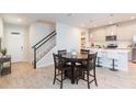 Inviting dining area and kitchen featuring modern appliances and stylish countertops at 2334 Audubon Preserve Ln, Lutz, FL 33558