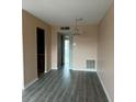 Open concept room offering a spacious area with modern flooring and an elegant chandelier at 24862 Us Highway 19 N # 1504, Clearwater, FL 33763