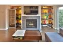 Living room features a fireplace, built-in shelving, and a modern coffee table at 2985 W Knights Ave # 2985, Tampa, FL 33611
