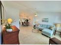 Bright living room featuring tile flooring, and a comfortable blue sectional sofa at 6707 Thorman Rd, Port Charlotte, FL 33981