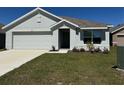 Charming single-story home with a well-maintained lawn and neat landscaping adds to its curb appeal at 11517 Timber Grove Ln, Brooksville, FL 34613