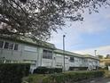 The condo community exterior is seen during the day at 1433 S Belcher Rd # A12, Clearwater, FL 33764