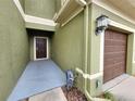 Exterior front entrance showing the front door and attached garage at 2807 Lantern Hill Ave, Brandon, FL 33511