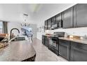 Well-lit kitchen with stainless steel appliances and an adjacent dining area at 3301 San Moise Pl, Plant City, FL 33567