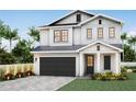 New construction, a modern two-story home with a two-car garage, neat landscaping, and a covered front entry at 3618 W Royal Palm Cir, Tampa, FL 33629