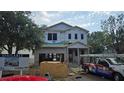 New construction home featuring concrete block, pre-install windows, and first layer weather protection at 3618 W Royal Palm Cir, Tampa, FL 33629