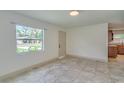 Bright living room featuring tile floors, ample natural light, and neutral walls at 3630 14Th S Ave, St Petersburg, FL 33711