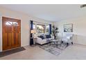 Cozy living room featuring a large window, comfortable seating, and a stylish rug on the floor at 5390 31St N Ave, St Petersburg, FL 33710