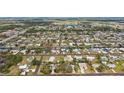 Extensive aerial panorama featuring a dense neighborhood interwoven with canals and waterways at 829 E 4Th St, Englewood, FL 34223