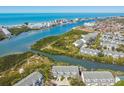 Breathtaking aerial view of waterfront community with ocean access and beautiful landscaping at 9770 Indian Key Trl # 102, Seminole, FL 33776