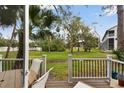 Relaxing outdoor patio overlooking a lush green back yard at 9770 Indian Key Trl # 102, Seminole, FL 33776