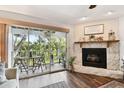 Screened-in porch with wood table and chairs, and views of the lush, green landscape at 9770 Indian Key Trl # 102, Seminole, FL 33776