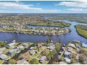 Breathtaking aerial view of the neighborhood, highlighting its canal-front homes, waterways, and scenic surroundings at 106 W North Branch Rd, Ruskin, FL 33570