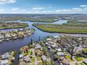 Scenic aerial view of the community, surrounded by tranquil waterways, lush vegetation, and serene atmosphere at 106 W North Branch Rd, Ruskin, FL 33570