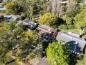 Birds eye view of the community featuring mature trees and well maintained homes at 1434 Glengarry Dr, Palm Harbor, FL 34684