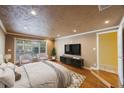 Spacious main bedroom with hardwood floors, a large window, and an en-suite bathroom at 15530 Morgan St, Clearwater, FL 33760