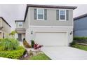 Beautiful two-story home with a two-car garage and lush landscaping at 29922 Marquette Ave, Wesley Chapel, FL 33545
