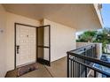 Condo entryway with tiled floor and a white front door with a decorative door knocker and security screen at 5505 Puerta Del Sol S Blvd # 428, St Petersburg, FL 33715