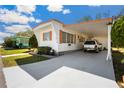Attractive single-story home with a convenient covered parking area and manicured lawn at 585 Sky Harbor Dr # 416, Clearwater, FL 33759