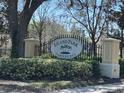 Close up view of the Eiland Park Townhomes community entrance sign, surrounded by manicured landscaping, creating a pleasant aesthetic at 6359 Timberly Ln, Zephyrhills, FL 33542