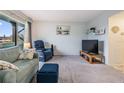Living area with large window, comfortable seating, and a neutral wall color at 2042 Australia W Way # 66, Clearwater, FL 33763