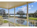 Relax on this porch with beautiful water views, white railings, and ample space at 2220 Spanish Dr # 4, Clearwater, FL 33763