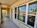 Private porch featuring windows and neutral paint at 2351 Irish Ln # 43, Clearwater, FL 33763