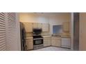 Well-equipped kitchen with stainless steel appliances and ample cabinet space at 3859 Pheasant Ct, Palm Harbor, FL 34685