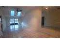 Spacious living room featuring a ceiling fan, and plenty of natural light at 3859 Pheasant Ct, Palm Harbor, FL 34685
