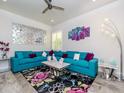 Living room area with colorful decor, a large sofa, and accent lighting at 5526 14Th S Ave, Gulfport, FL 33707