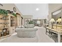 Spacious living room featuring stylish furniture, built-in shelving and ample natural light at 7435 Woodhollow Rd, Spring Hill, FL 34606