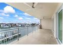 Wide balcony view showcasing waterfront living with scenic views of the marina and surrounding neighborhood at 125 Island Way # 404, Clearwater Beach, FL 33767