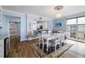 Light-filled dining room with stylish decor and a view to the kitchen at 2 15Th Ave # 301, Indian Rocks Beach, FL 33785