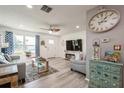 Inviting living room showcasing hardwood floors, modern furnishings, and sun-filled windows at 3715 98Th N Ave # 3, Pinellas Park, FL 33782