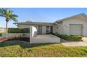 Well-maintained single-story home with landscaped front yard, and an attached one-car garage at 4582 Fox Lake Ct, Clearwater, FL 33762