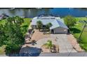 Charming single Gathering home with metal roof, well-manicured landscaping, and a spacious driveway at 5024 Cedarbrook Ln, Hernando Beach, FL 34607