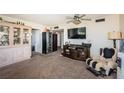 Cozy living room featuring comfortable seating, a display cabinet, and ample natural light at 6210 Sun Blvd # 408, St Petersburg, FL 33715