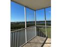Balcony showing the waterfront view with trees and a lake at 6425 Shoreline Dr # 10506, St Petersburg, FL 33708