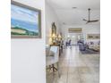 Bright living room featuring tile floors, ceiling fan and views of the home's other rooms at 992 San Carlos Ne Ct, St Petersburg, FL 33702