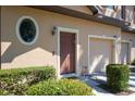 An entrance to the home with a beautiful and clean landscape at 10249 Villa Palazzo Ct, Tampa, FL 33615