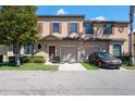 Charming townhome featuring a one-car garage, and inviting landscaping in a well-maintained neighborhood at 10249 Villa Palazzo Ct, Tampa, FL 33615