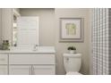 Bright bathroom with a white vanity, clean lines, neutral wall decor, and a shower with a decorative curtain at 106 Lilyan Ct, Rotonda West, FL 33947